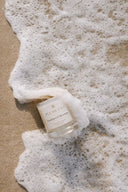 pleascent-eucalyptus-spearmint-coconut-wax-candle-beach-foam resting on san aestehtic